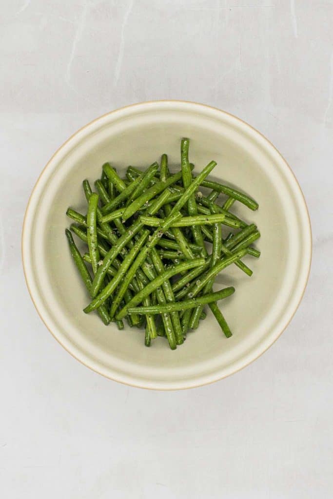 Green beans tossed in olive oil, kosher salt and pepper.