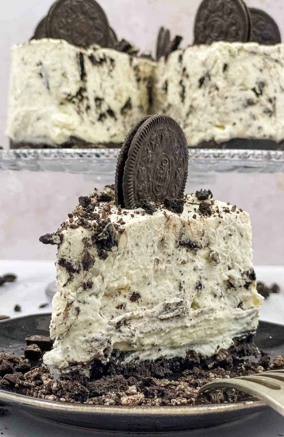 A slice of no bake Oreo cheesecake on a plate.