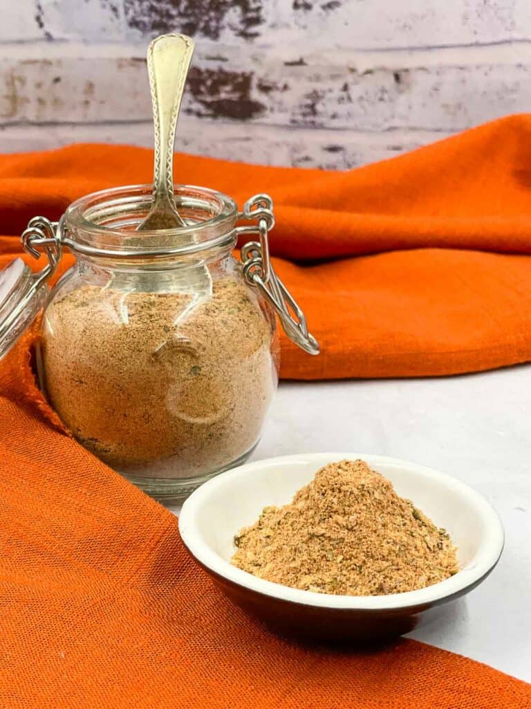 Spice blend in a jar and a small serving bowl.