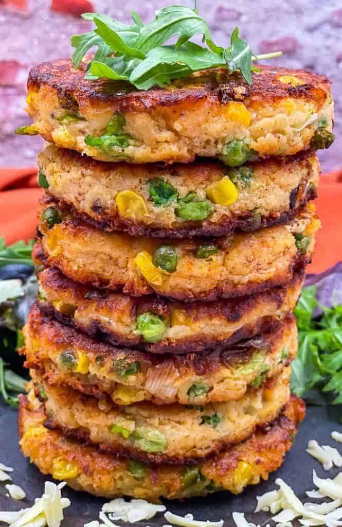 A stack of potato fritters on a plate.