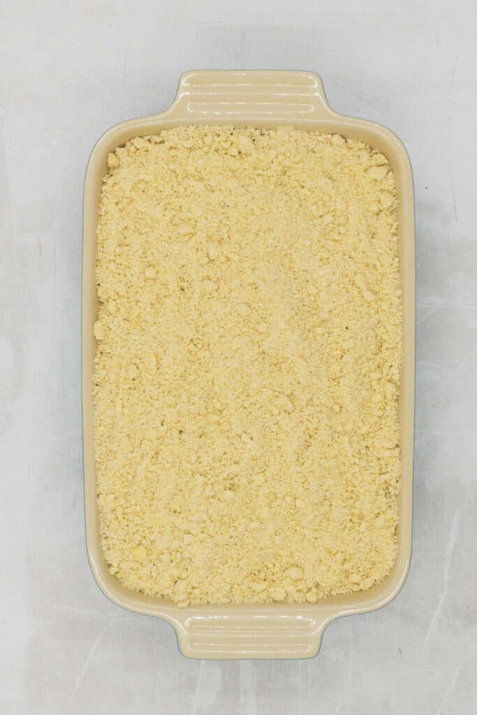 Veganized apple crumble in an baking dish ready for the oven.