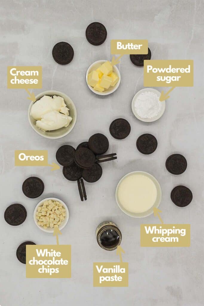 Ingredients needed, full fat cream cheese, butter, powdered sugar, whipping cream, vanilla paste, white chocolate chips, and Oreos.