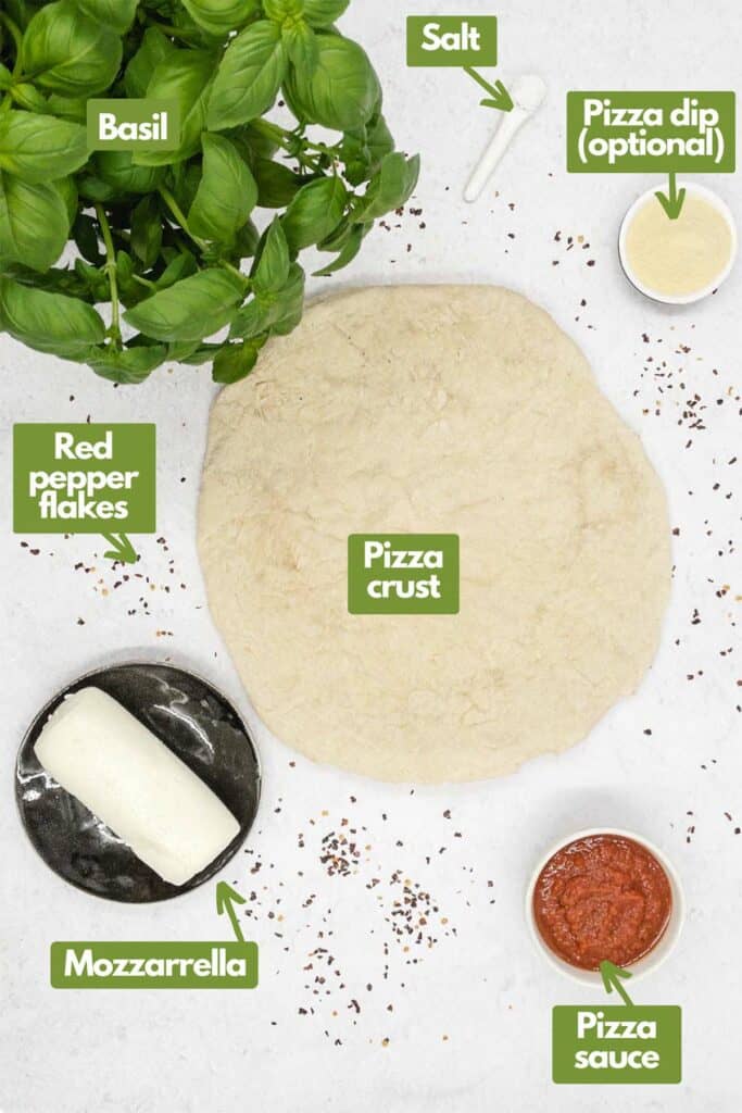 Ingredients needed; basil, salt, pizza dip, pizza crust, pizza sauce, mozzarella cheese, and red pepper flakes.
