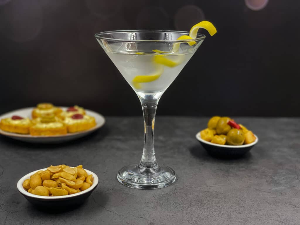 A beautiful shot of a James Bond cocktail vodka martini with a lemon twist in it.