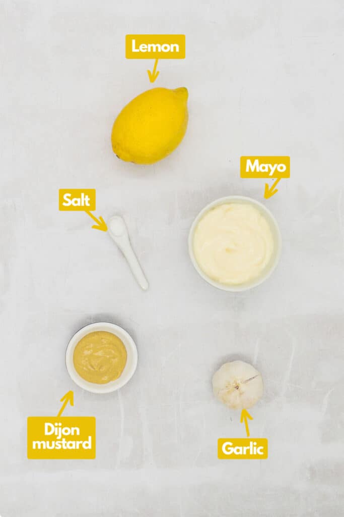 Ingredients needed, lemon, mayo, salt, Dijon mustard, and garlic.