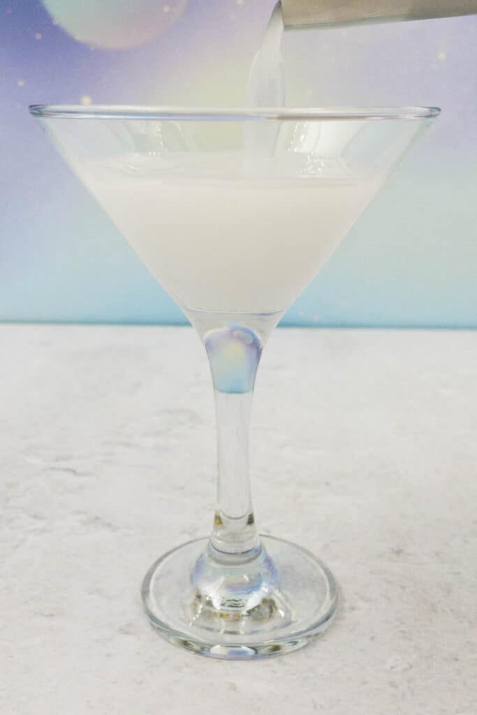 Pour into a martini glass.
