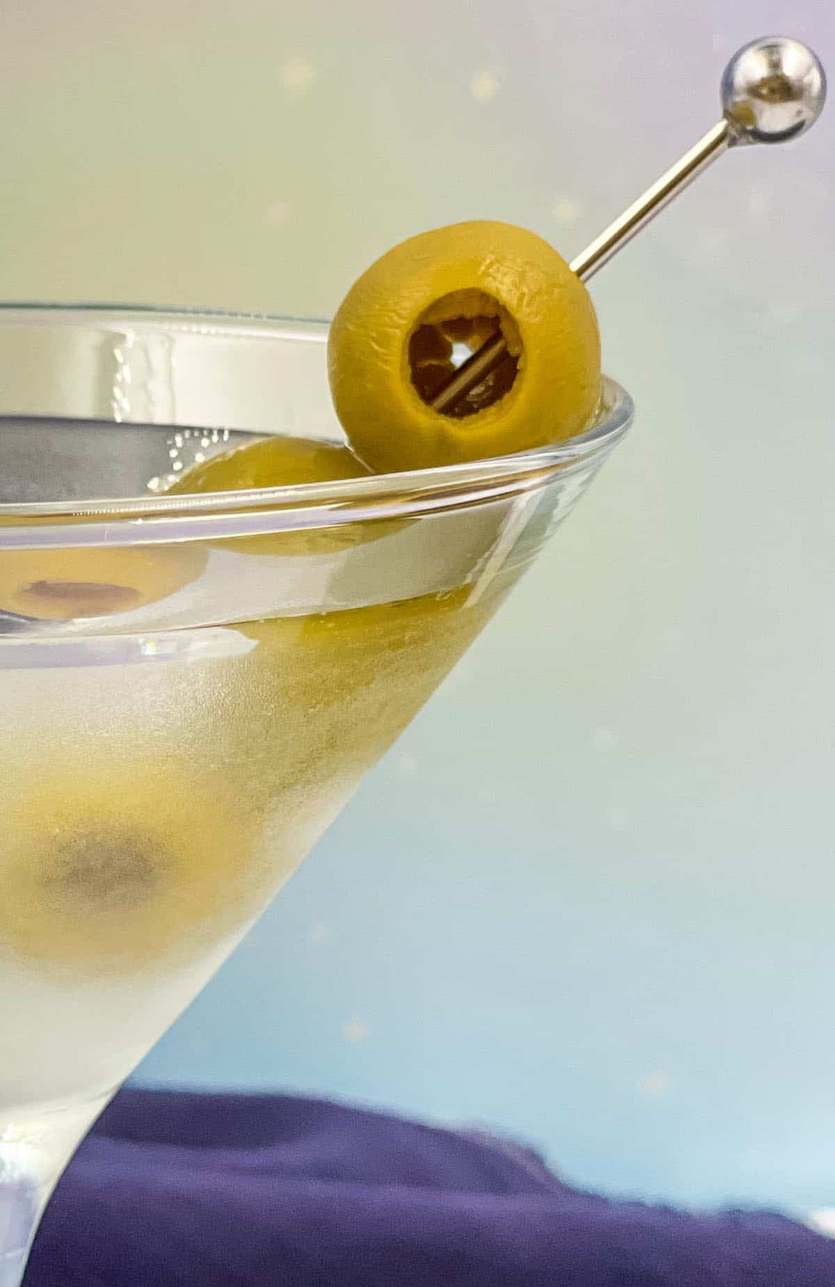 Vodka martini in a glass with olives.