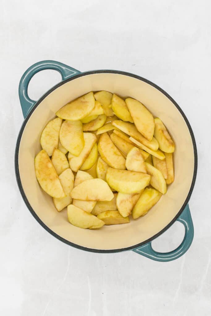 Apple slices cooked in a Dutch oven.