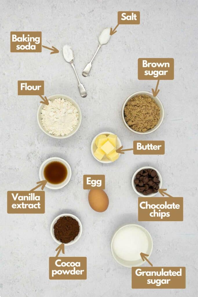 Ingredients needed; baking soda, salt, brown sugar, butter, chocolate chips, granulated sugar, egg, unsweetened cocoa powder, vanilla extract, and flour.