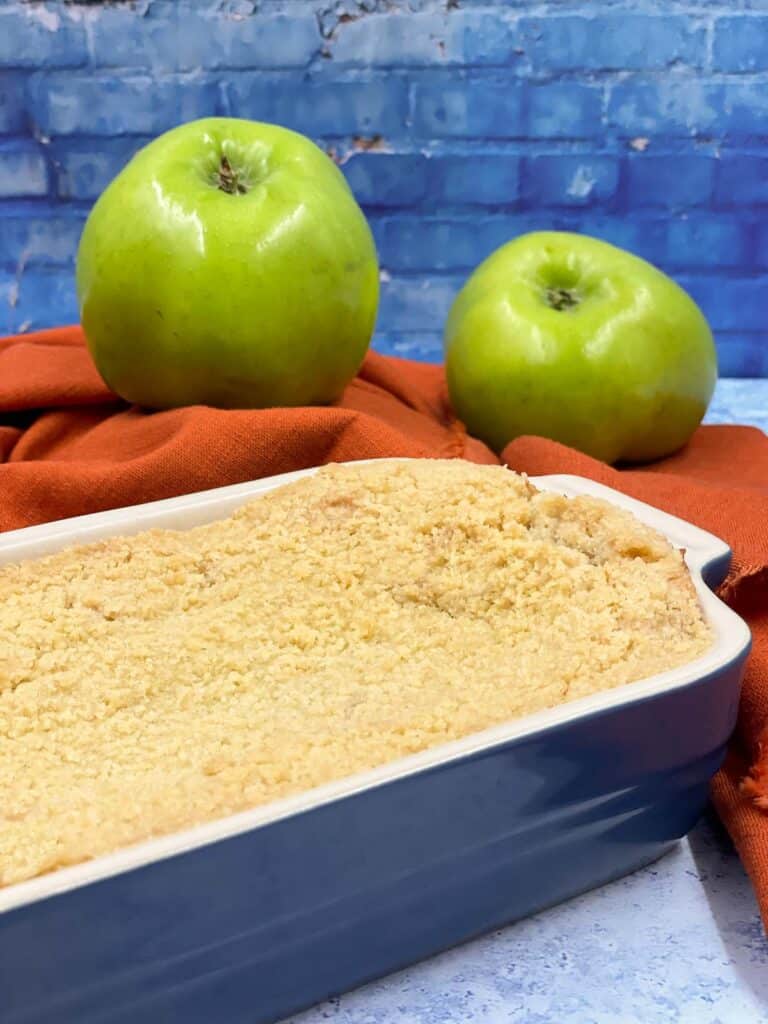 An oven dish full of freshly made apple crumble.