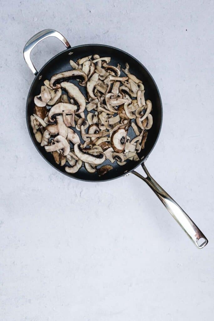 Mushrooms cooked in a skillet.