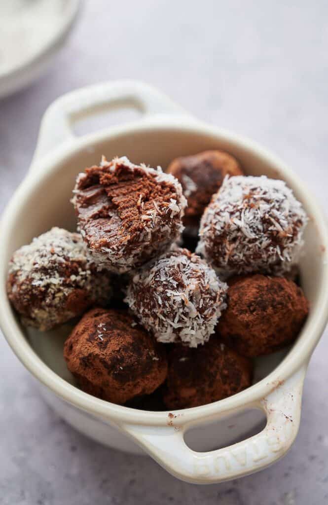 Chocolate truffles freshly made in a small bowl.