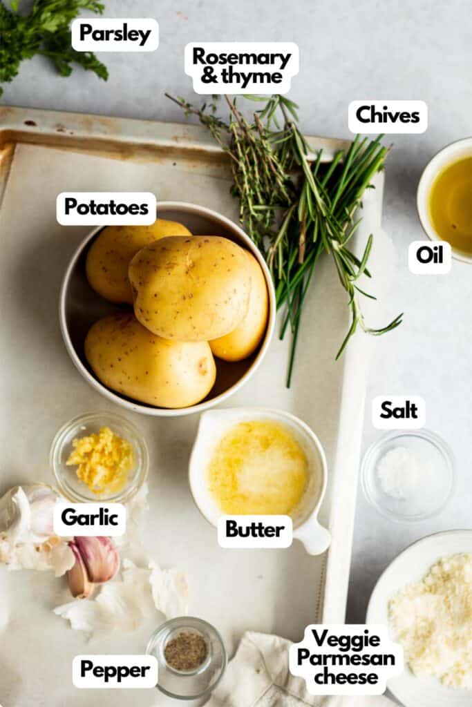 Ingredients needed, parsley, rosemary, thyme, chives, oil, salt, butter, vegetarian Parmesan cheese, pepper, fresh garlic, and potatoes.