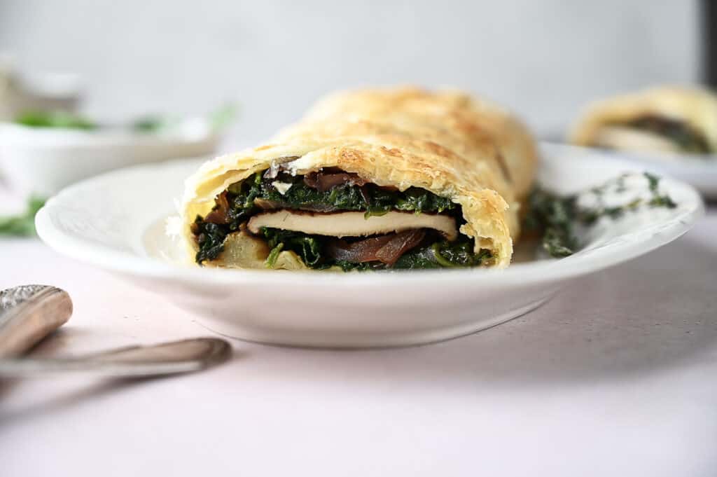 Delicious mushroom wellington slice showing the insides of it.