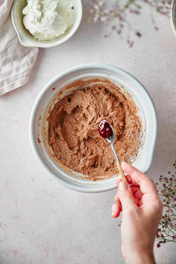 Add red food coloring into the mixture.