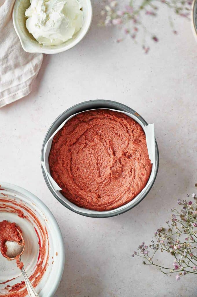 Cake batter in a cake pan.