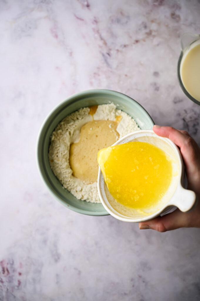 Pouring egg mixture to flour.