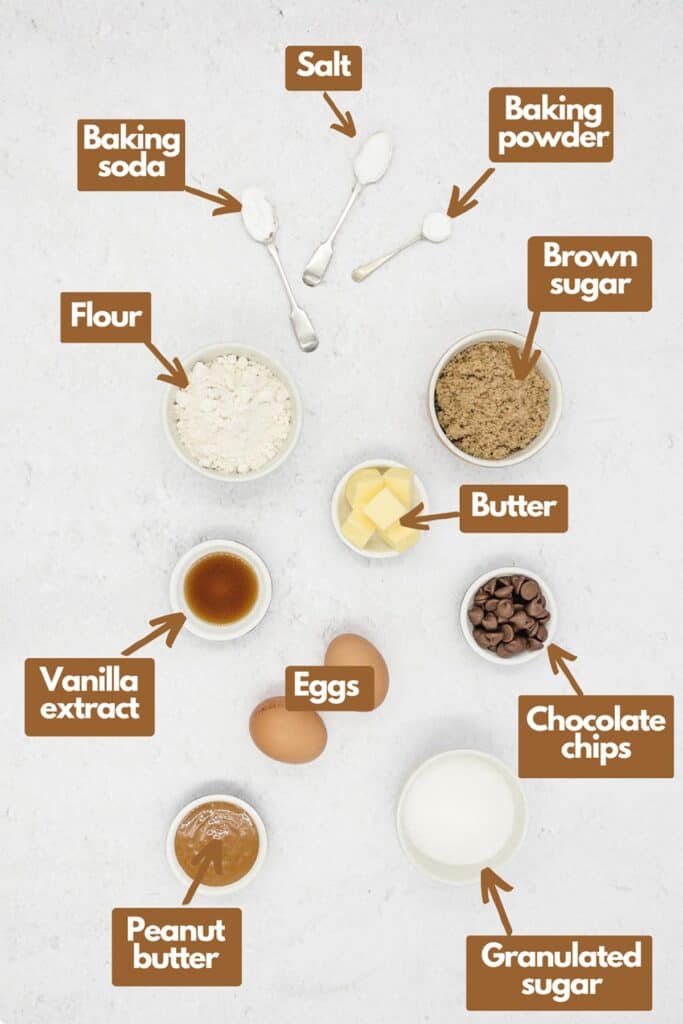 Ingredients needed; baking soda, salt, baking powder, brown sugar, butter, chocolate chips, granulated sugar, eggs, peanut butter, vanilla extract, and flour.