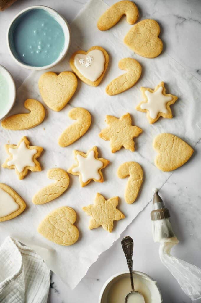Partially iced sugar cookies.