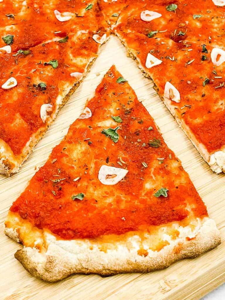 Marinara pizza sliced and ready to eat.