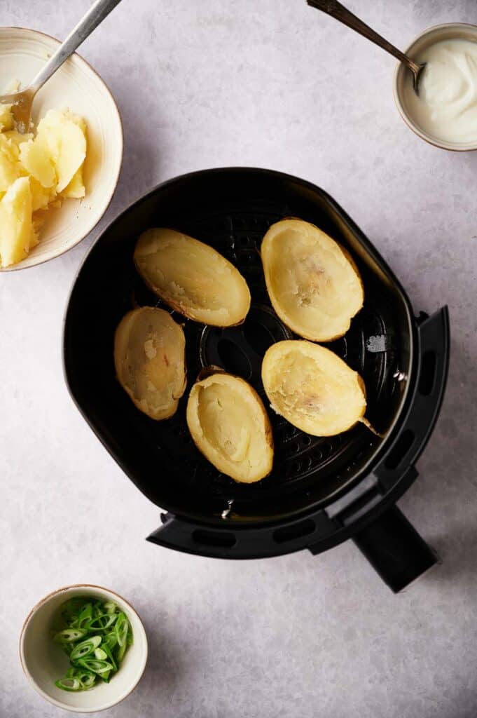 Potatoes with the flesh scooped out from them.