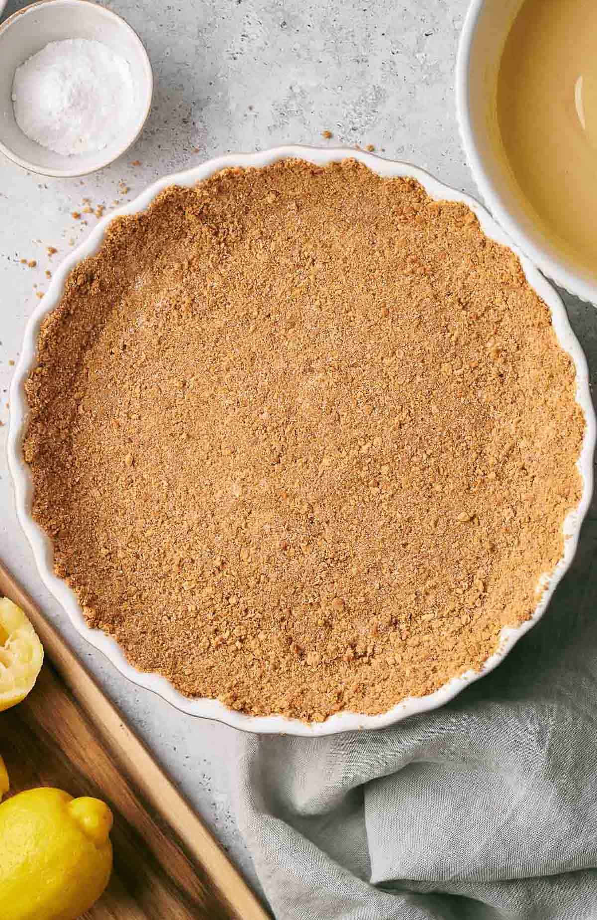 Graham cracker crust in a pie dish.