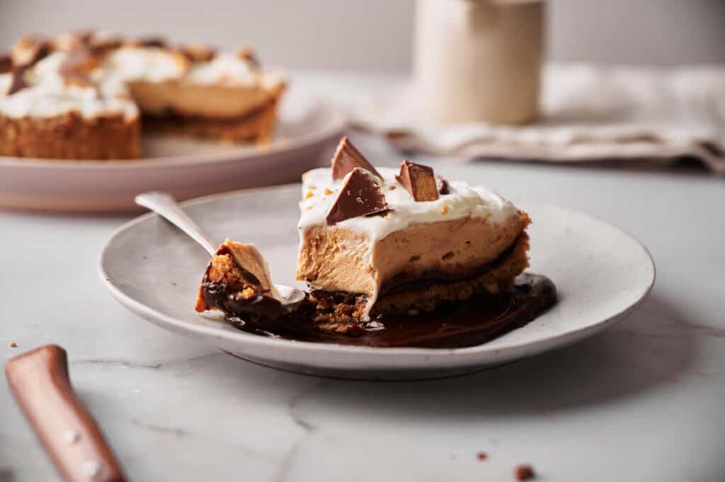 Hot fudge sauce poured over a Reese's peanut butter pie.