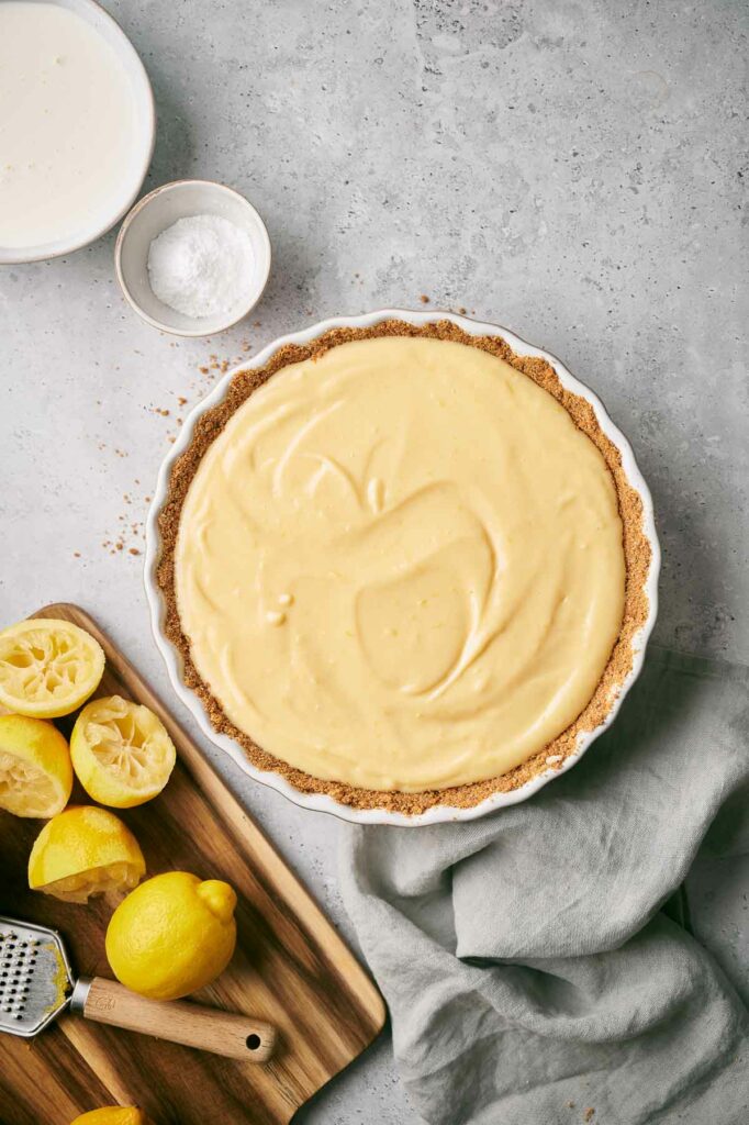 Lemon filling place on prepared pie crust.
