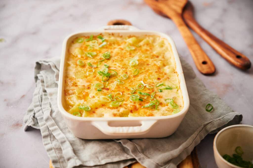 A cheesy potato casserole freshly made and ready to eat.