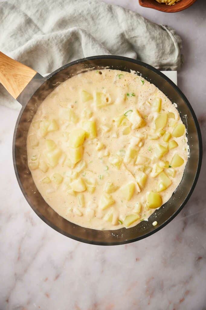 Potatoes coated with the casserole sauce.