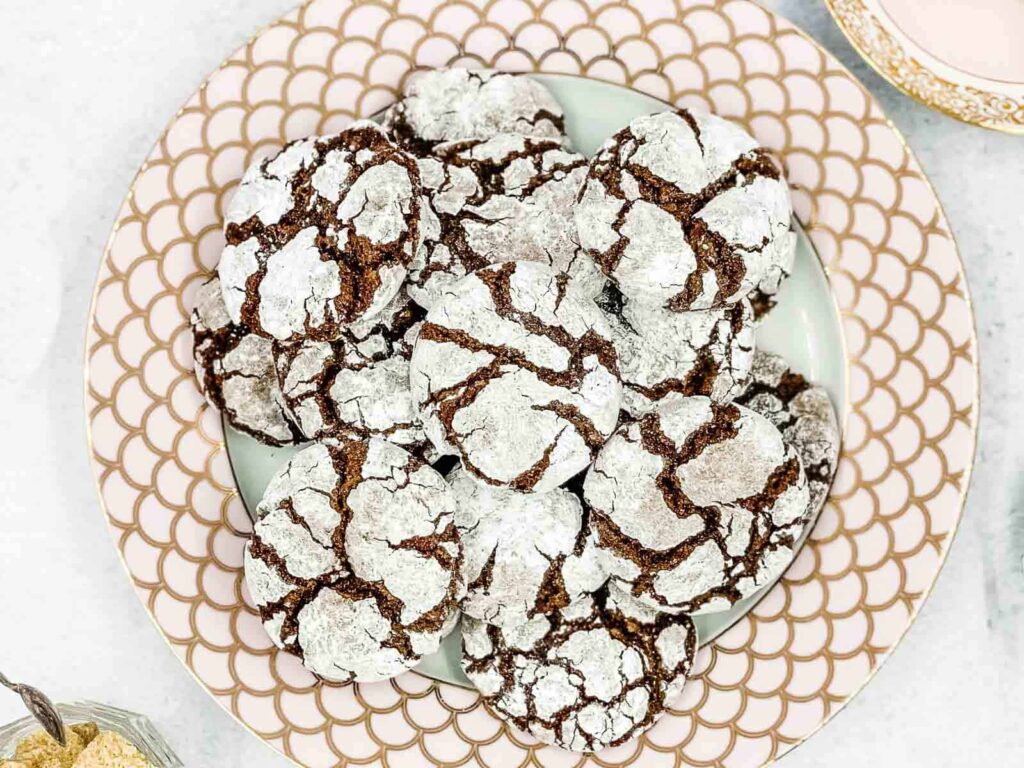 Chocolate crinkle cookies on a plate.