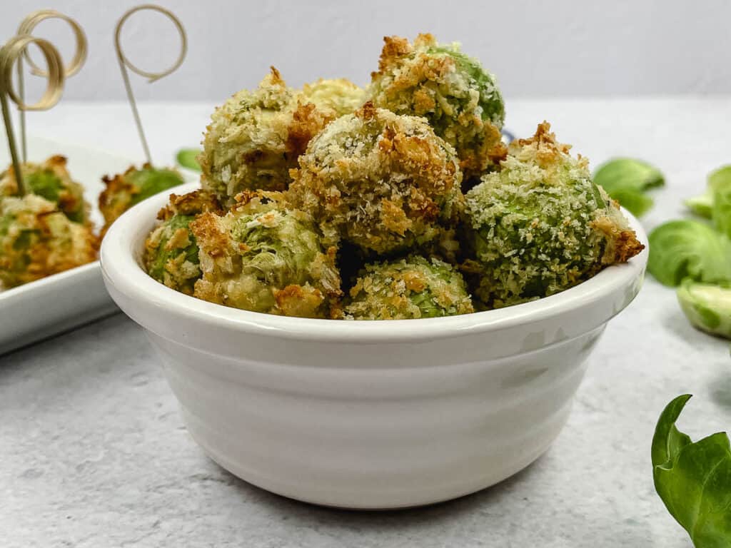 Cheesy Brussels sprouts bites in a serving bowl.