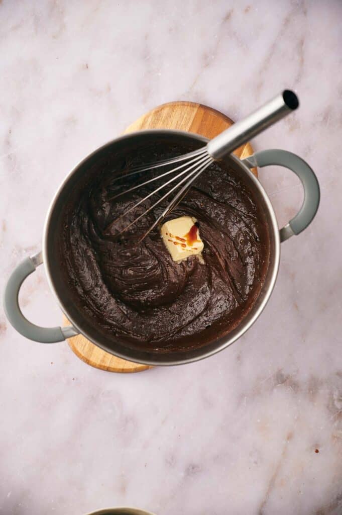 A pat of butter added to the chocolate mix.