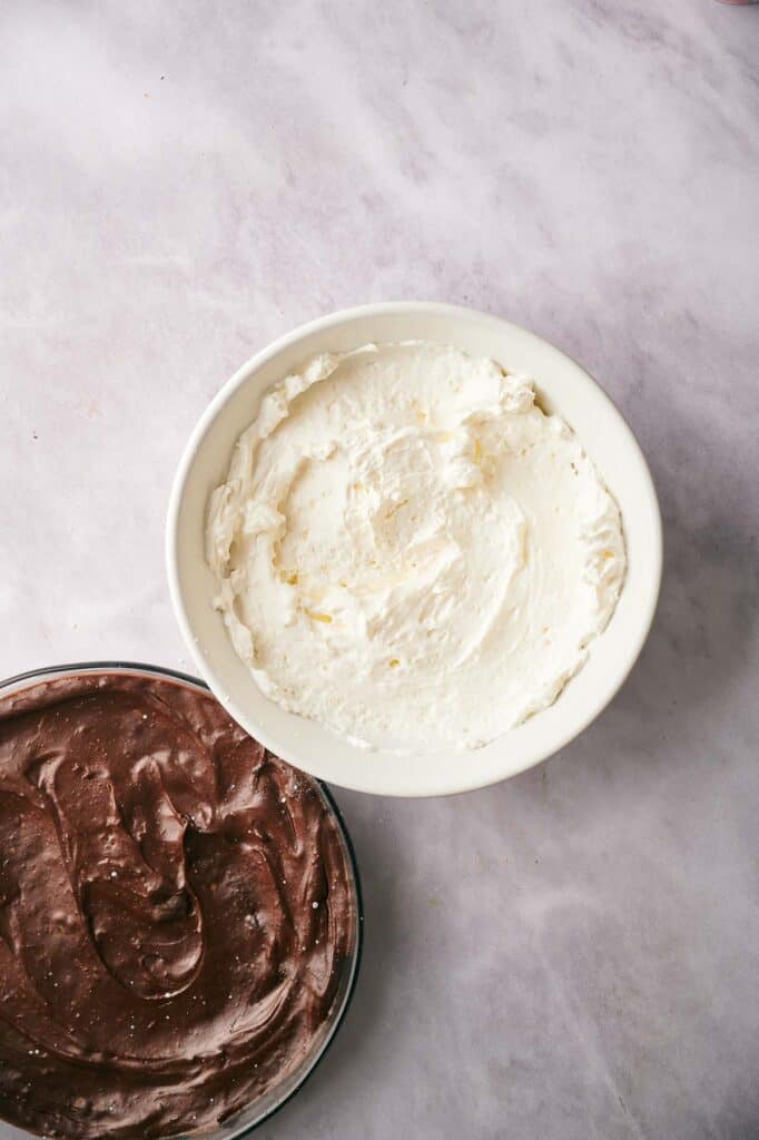Whipped cream in a mixing bowl.