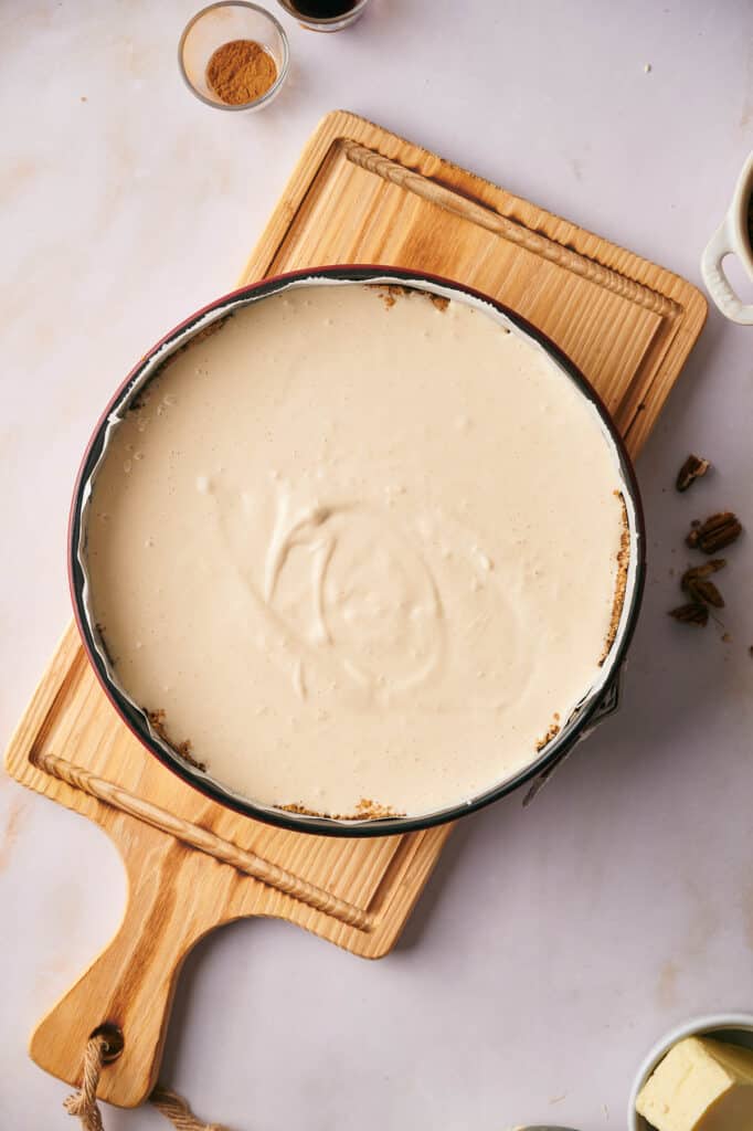 Pecan pie cheesecake filling in a pan ready to cook.