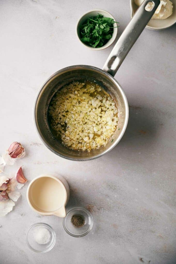 Garlic and onion sauteed in a pan.