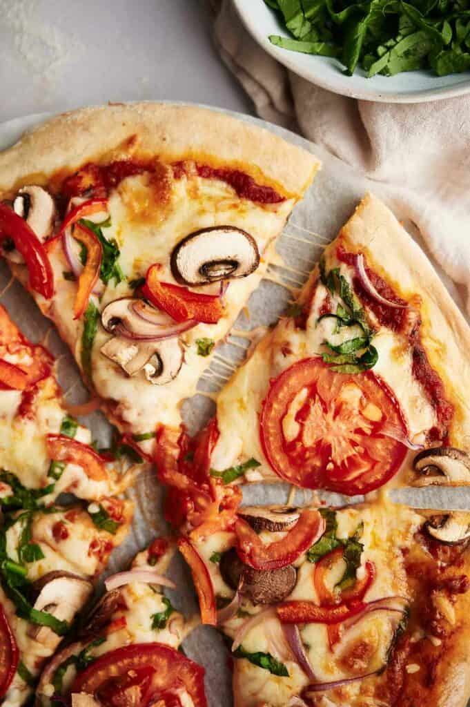 Vegetarian pizza slices ready to eat.