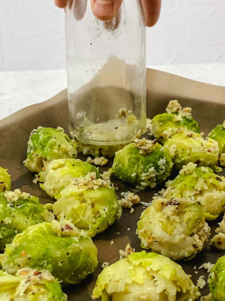 Smashing the Brussels sprouts with a jar.