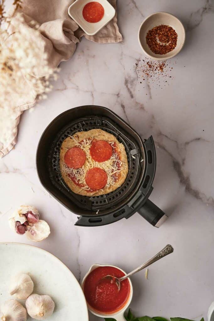 Veggie pepperoni added to the tortilla pizza.