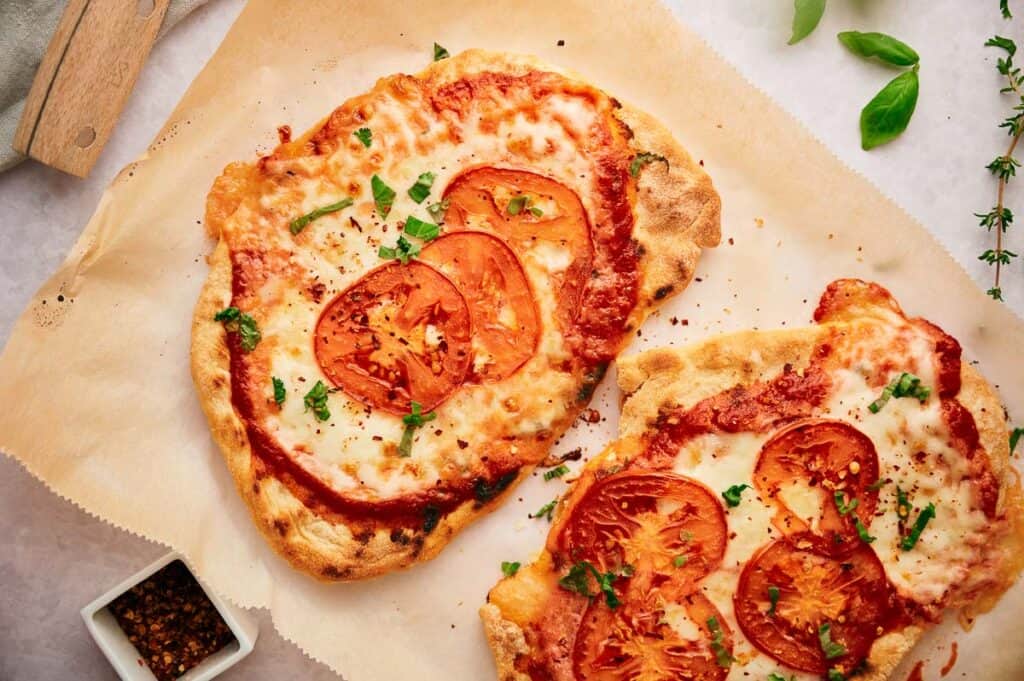 Two delicious Margherita flatbread pizzas, ready to eat.