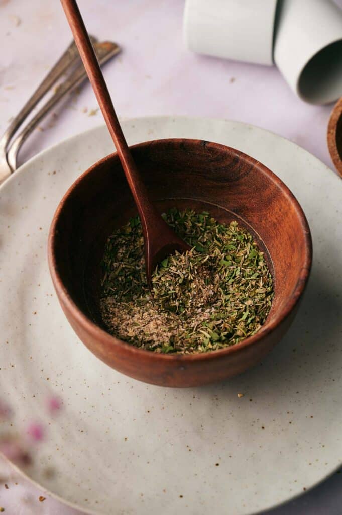 Pizza seasoning blend in a small bowl.