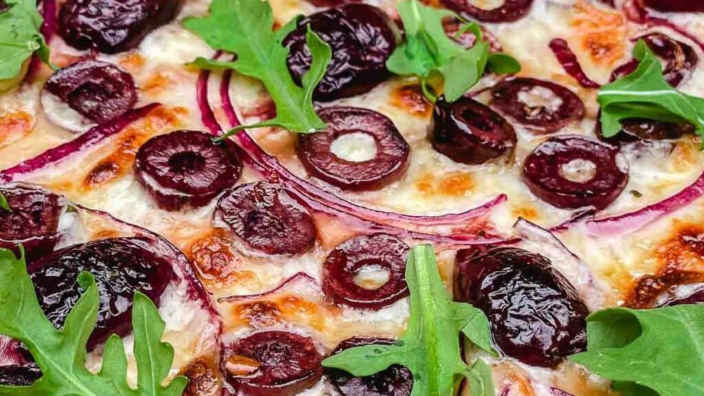 Freshly made olive pizza.