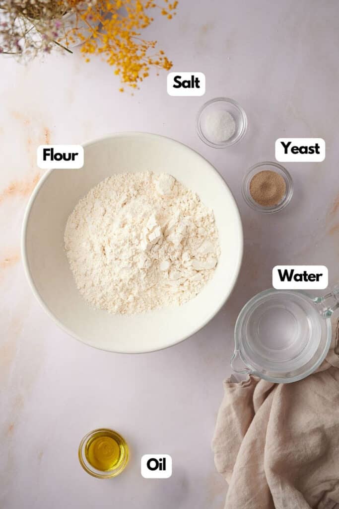 Ingredients needed, bread flour, salt, yeast. warm water, and olive oil.