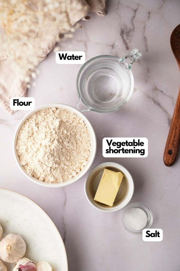 Ingredients needed; warm water, all-purpose flour, vegetable shortening, and salt.
