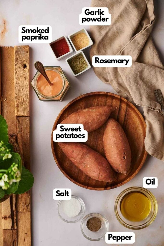 Ingredients needed, smoked paprika, garlic powder, dried rosemary, sweet potatoes, olive oil, salt, and black pepper.