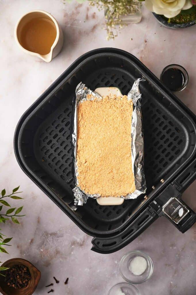 Tofu mixture in air fryer basket.
