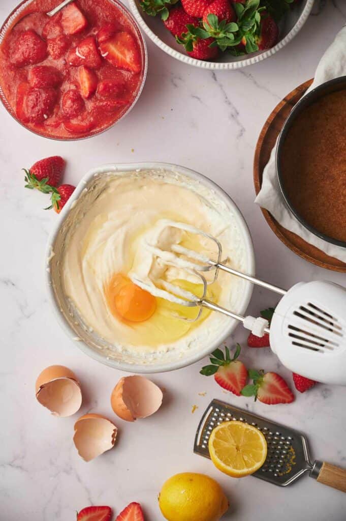 Eggs added to cheesecake mixture.