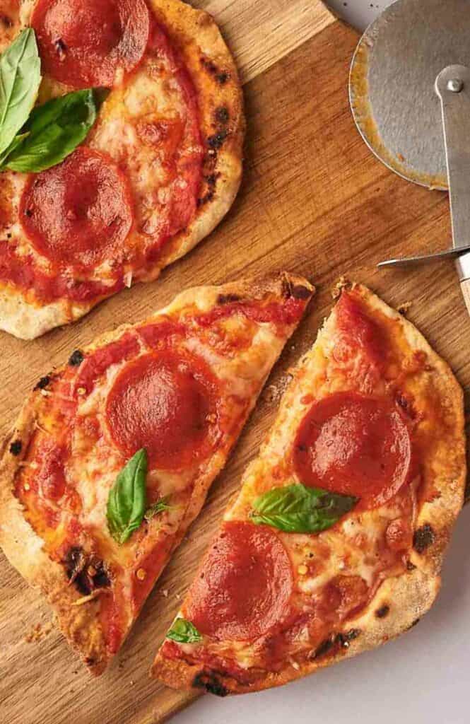 Easy tortilla pizza, sliced with a pizza cutter.