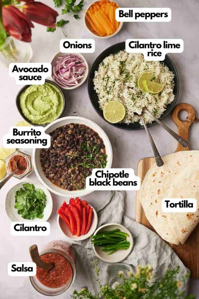 Ingredients needed, avocado sauce, onions, bell peppers, cilantro lime rice, tortillas, poblano peppers, salsa, fresh cilantro, and burrito seasoning.