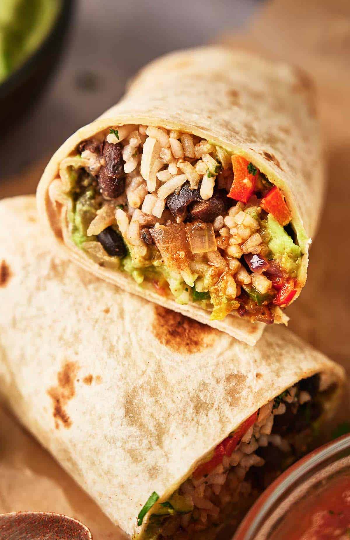 Vegetarian burrito filled with rice and beans and ready to eat.